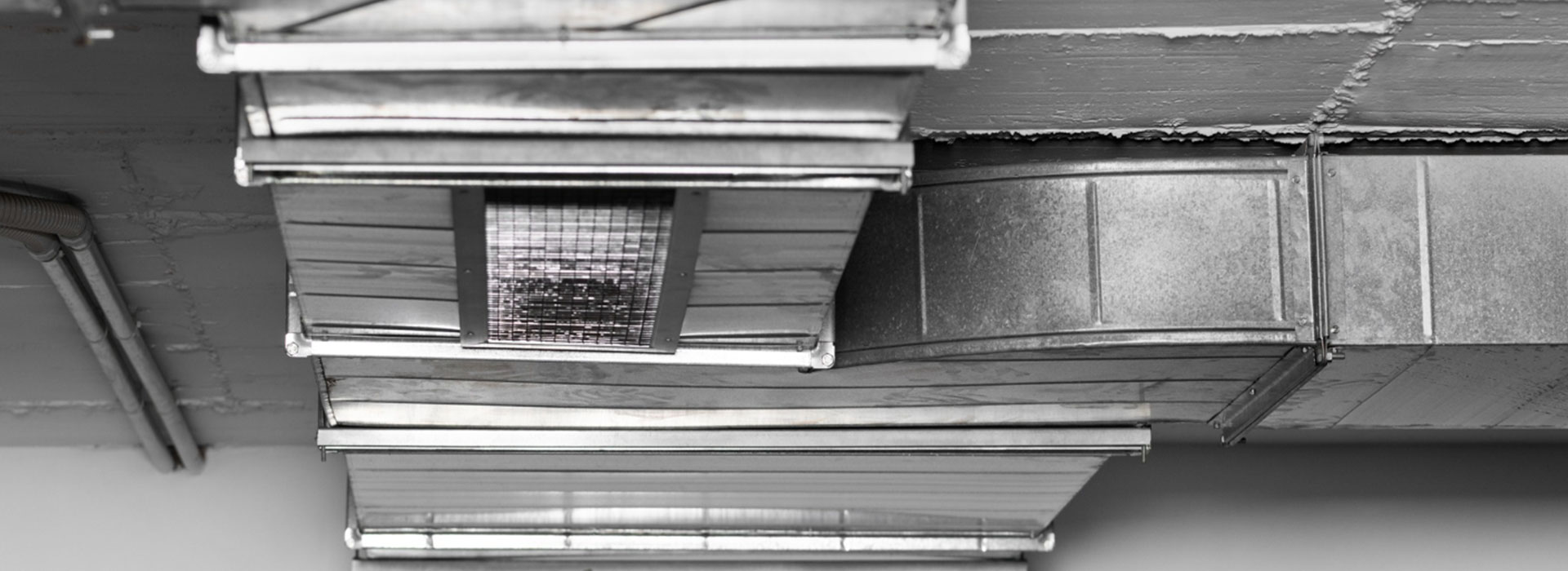 Technician cleaning air ducts
